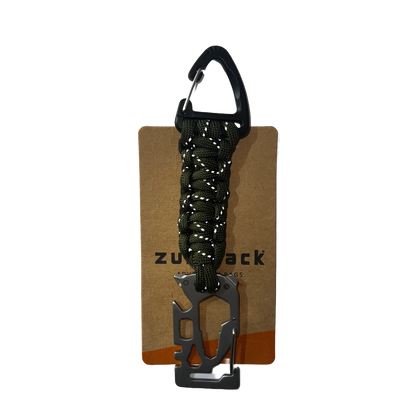 Multitool with carabiner and paracord on a branded card with 'Zulupack' logo.